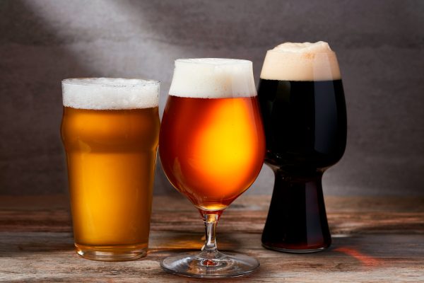 pale, amber, and dark beers in glasses