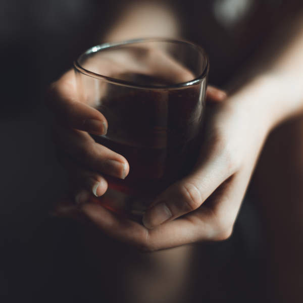 hands holding glass