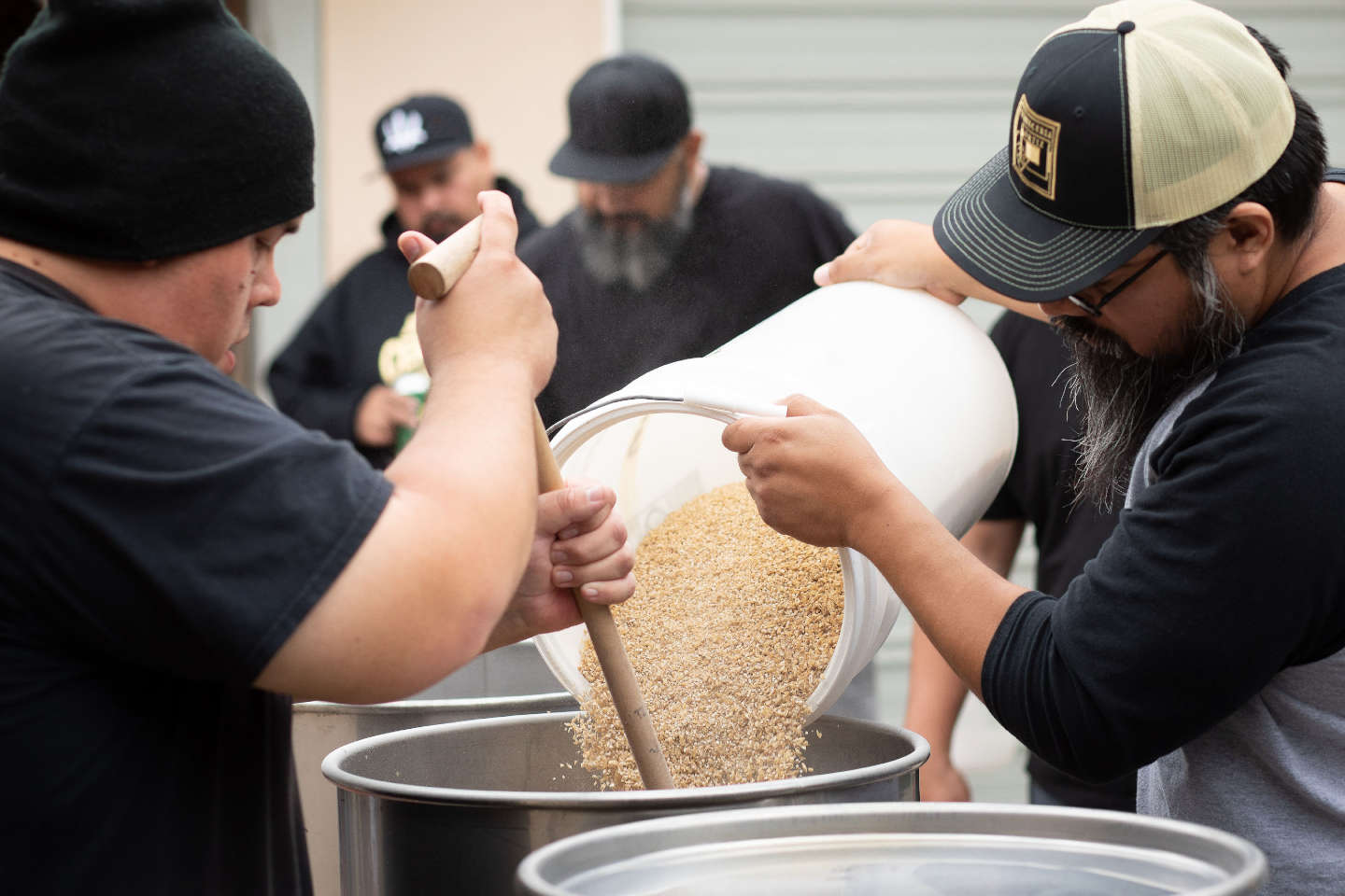 homebrewers mashing in