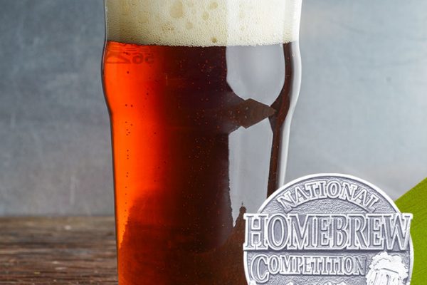 red-brown-colored beer in pint glass